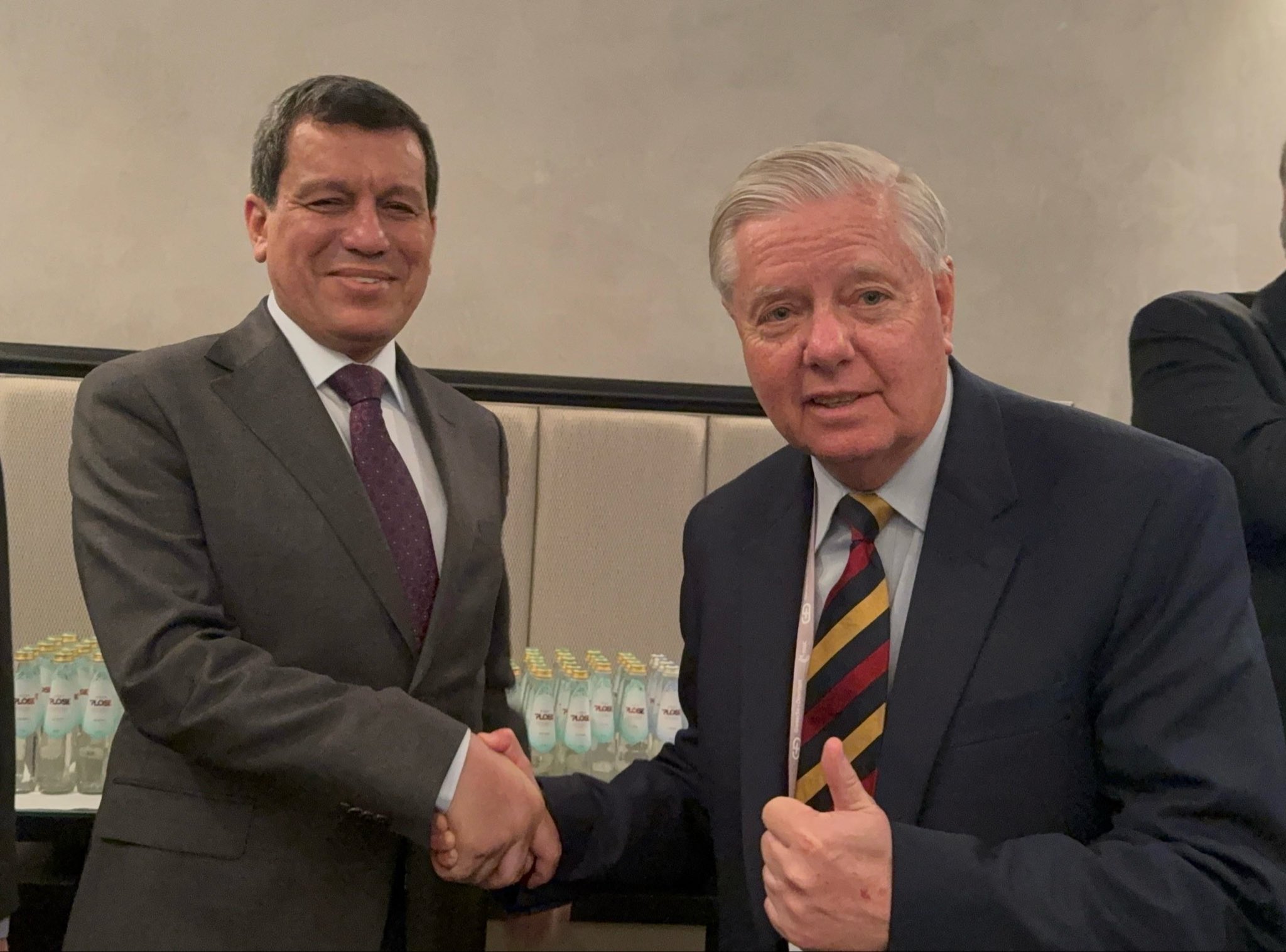Mazloum Abdi, General Commander of the Syrian Democratic Forces (left) and late U.S. Senator Lindsey Graham 

