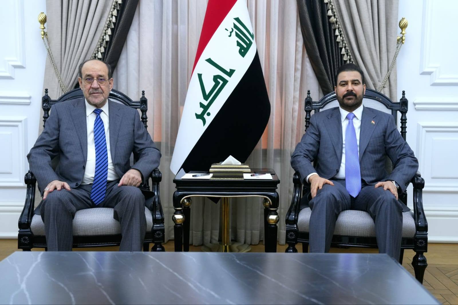 Iraqi Prime Minister Ali Faleh al-Zaidi and State of Law Coalition leader Nouri al-Maliki