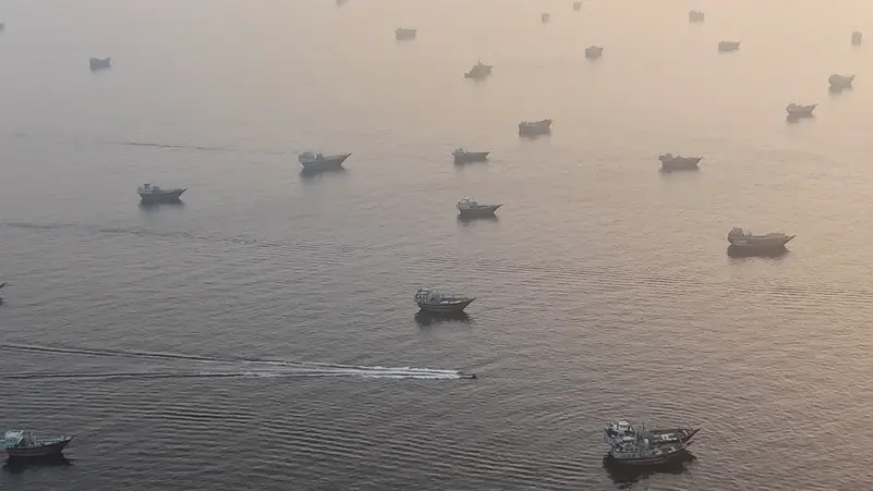 A drone view shows vessels in the Strait of Hormuz, as seen from Musandam, Oman, June 15, 2026.