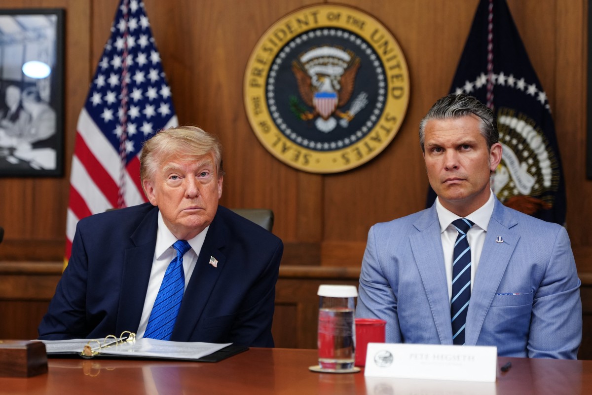 US President Donald Trump and US Secretary of Defense Pete Hegseth listen to questions from the press during a Cabinet meeting at Camp David in Maryland, on July 31, 2026. (Photo by Aaron Schwartz / AFP)