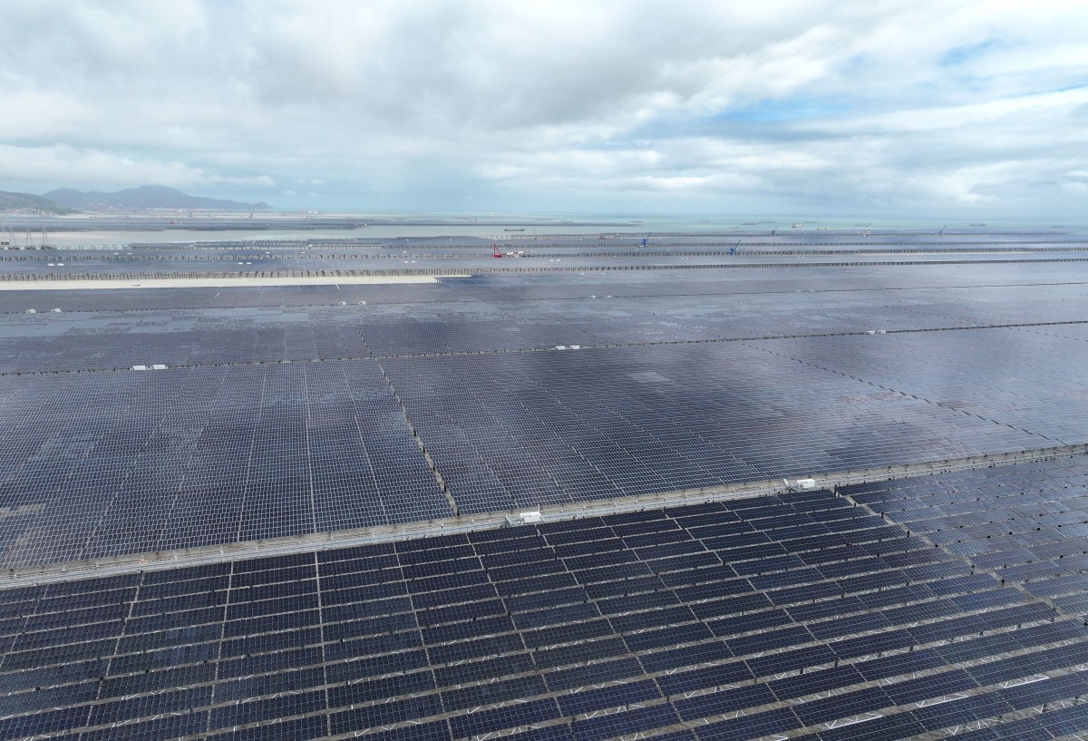 This aerial photo shows a general view of solar panels at the construction site of the CNNC Tianwan Tidal Flat Photovoltaic in Lianyungang, Chinas eastern Jiangsu province on August 23, 2026. (Photo by CN-STR / AFP) / China OUT