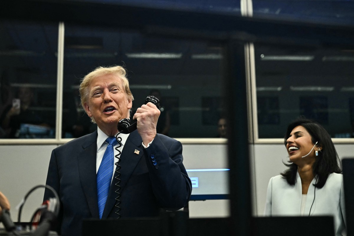 US President Donald Trump talks on the phone with crew members of the International Space Station (ISS) at Mission Control Center at NASA Lyndon B. Johnson Space Center in Houston, Texas, on August 28, 2026.   (Photo by Kent NISHIMURA / AFP)