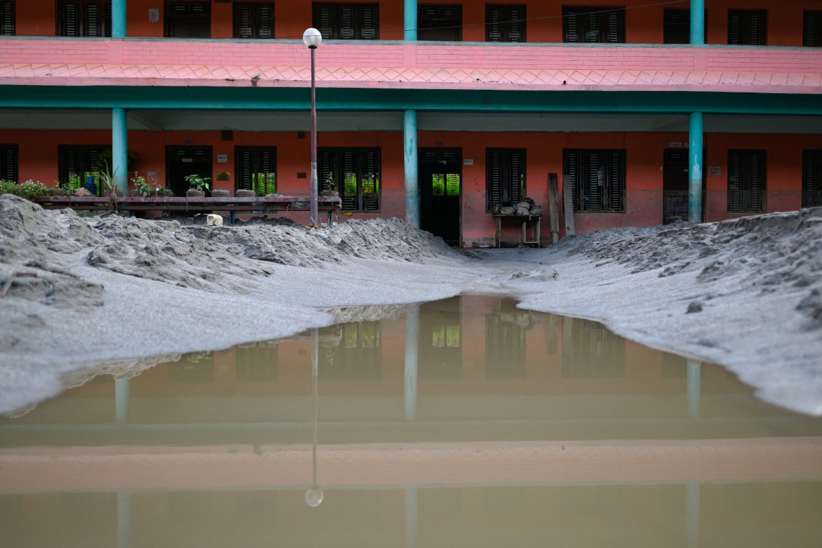 A general view shows the Bageshwori secondary school complex covered heavily in sludge in the aftermath of flash floods in Galchi town of Nepal's Dhading district on August 30, 2026.
