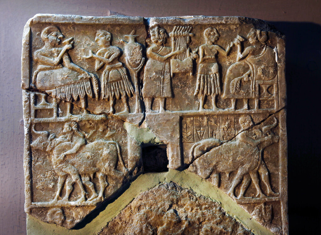 A recovered stone is displayed at the Iraqi National Museum in Baghdad, Iraq, Monday, April 1, 2013. Tens of thousands of artifacts chronicling some 7,000 years of civilization in Mesopotamia are believed to have been looted from Iraq in the chaos which followed the the US-led invasion in 2003. Despite international efforts to track items down, fewer than half of the artifacts have so far been retrieved. (AP Photo/Hadi Mizban)