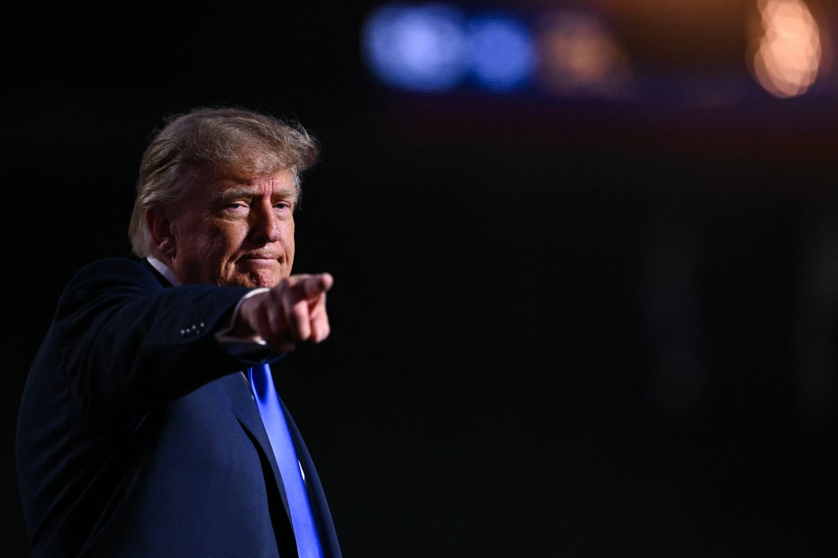 US President Donald Trump gestures after concluding his remarks during the Republican National Midterm Convention at the American Airlines Center in Dallas, Texas on September 9, 2026. US Republicans open an extraordinary midterm convention in Dallas on September 9 betting that putting Donald Trump at the center of their campaign can rescue a party facing grim election forecasts -- despite the president's negative approval ratings. (Photo by RONALDO SCHEMIDT / AFP)
