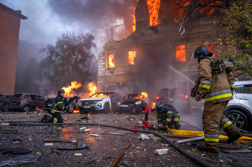 Rescue workers put out a fire at the National Academy of Sciences building damaged after a Russian drone strike in the center of Kyiv, Ukraine, Monday, Sept. 28, 2026. (AP Photo/Dan Bashakov)