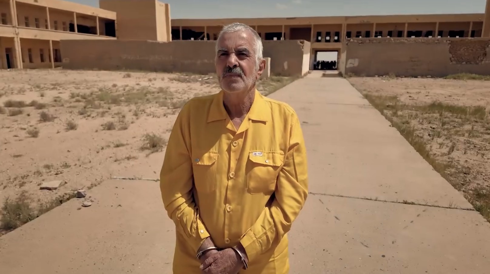 Ajaj Ahmed Hardan al-Tikriti was escorted back to the Nugra Salman prison site in handcuffs on May 7, 2026 

