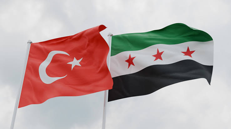 Syrian and Turkish national flags side-by-side.