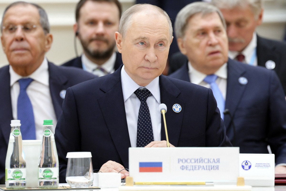 In this pool photograph distributed by the Russian state agency Sputnik, Russia's President Vladimir Putin attends a meeting of the Commonwealth of Independent States (CIS) Heads of State Council in Turkmenbashi on October 9, 2026. (Photo by Gavriil Grigorov / POOL / AFP)