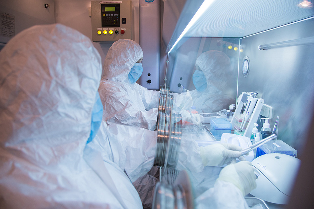This undated photo released by the Irkutsk Anti-Plague Research Institute of Siberia and Far East, shows the institute workers in a lab. (The Irkutsk Anti-Plague Research Institute of Siberia and Far East via AP)