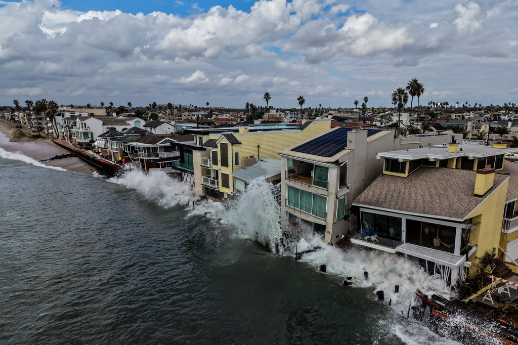 Waves from post-tropical cyclone Rachel crash into beachfront homes in Long Beach, Calif., Monday, Oct. 12, 2026. (AP Photo/Jae C. Hong)