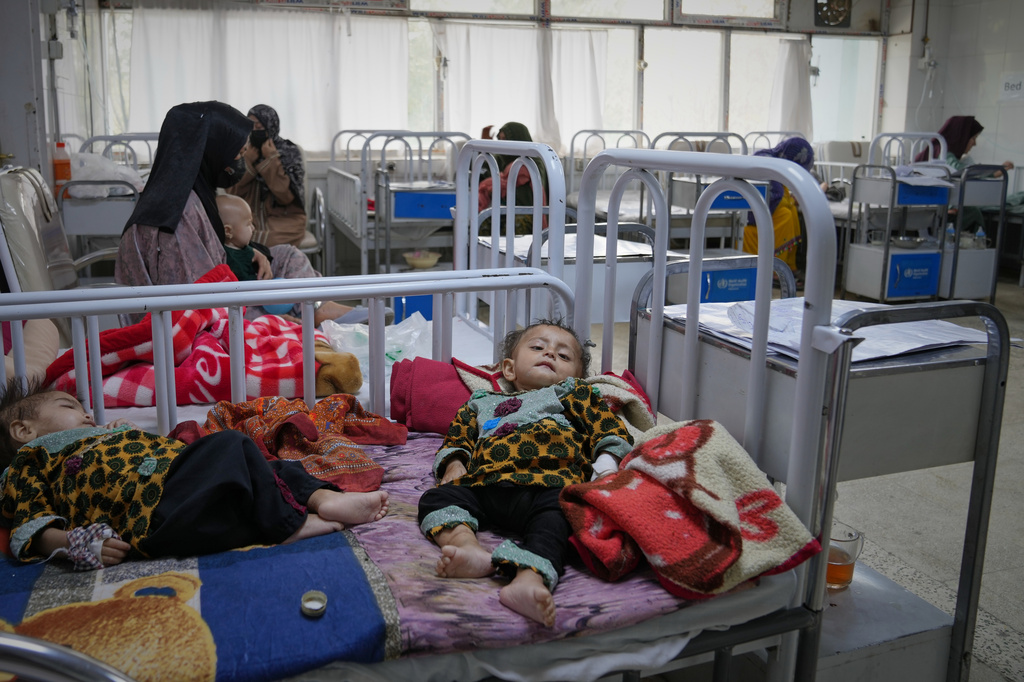 Afghan women care for their children in the malnutrition ward at Indira Gandhi children's hospital in Kabul, Afghanistan, Monday, Oct. 12, 2026. (AP Photo/Siddiqullah Alizai)