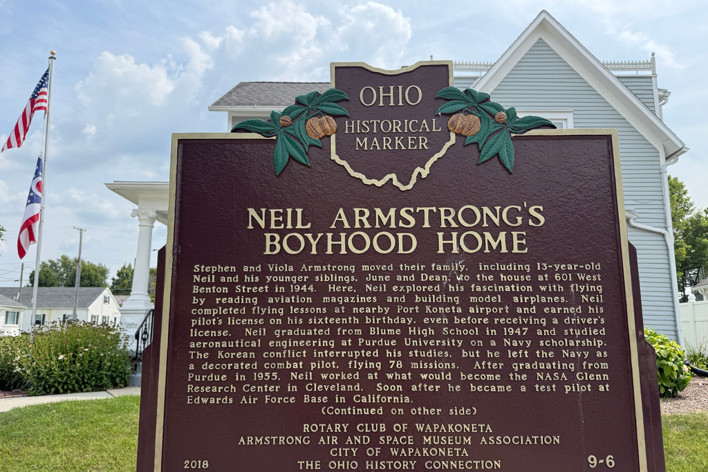 FILE - An Ohio historical landmark sign is displayed outside the former home of Neil Armstrong Friday, July 31, 2026, in Wapakoneta, Ohio. (AP Photo/Patrick Aftoora-Orsagos, file)