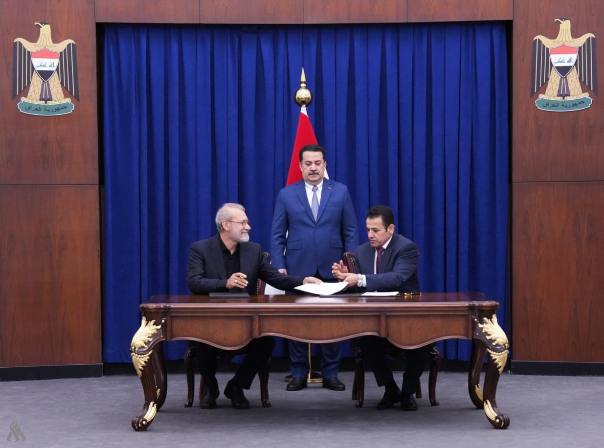 ساتی واژۆکردنی رێککەوتنی ئەمنیی نێوان ئێران و عێراق، لەلایەن قاسم ئەعرەجی و عەلی لاریجانی بەئامادەبوونی سودانی